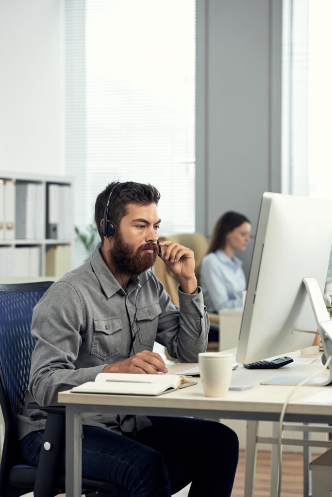 Helpdesk Operator Working With Client